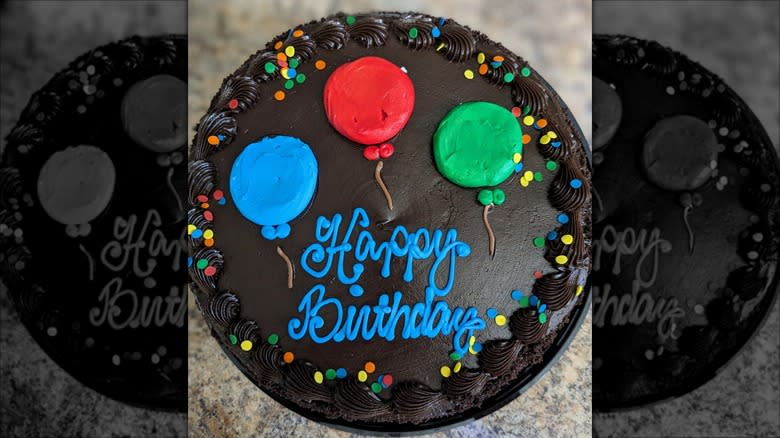 Black decorated Costco birthday cake