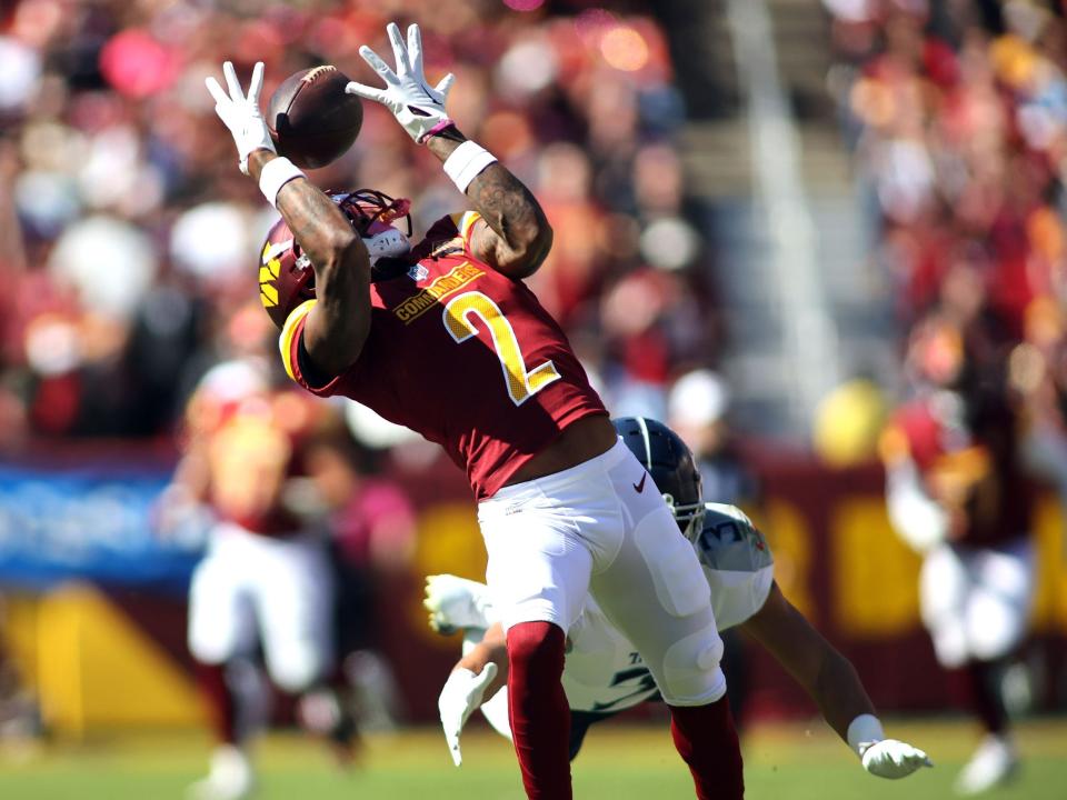 Dyami Brown reels in a catch against the Tennessee Titans.