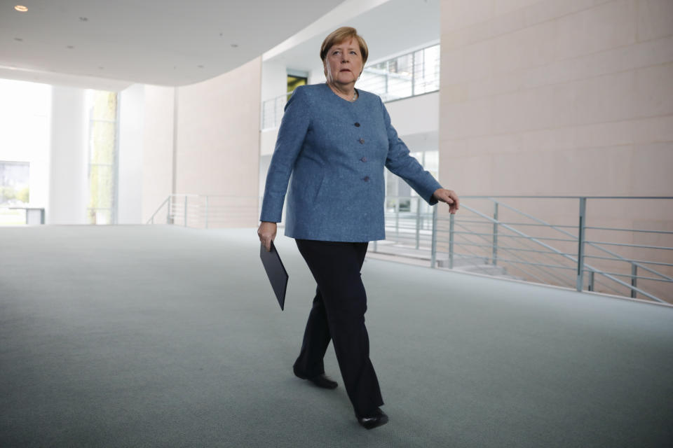 German Chancellor Angela Merkel arrives for a statement about latest developments in the case of Russian opposition leader Alexei Navalny at the chancellery in Berlin, Germany, Wednesday, Sept. 2, 2020.Germany. Russian opposition leader Alexei Navalny was the victim of an attack and poisoned with the Soviet-era nerve agent Novichok, the German government said Wednesday, Sept. 2, 2020 citing new test results. (AP Photo/Markus Schreiber, Pool)