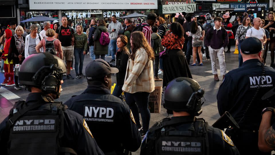 Members of the New York City Police Department Counterterrorism Unit patrol in Times Square on Thursday. - Brendan McDermid/Reuters