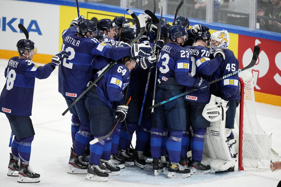 Team Finland celebrates victory after a match between Finland and the the United States in the semifinals of the Hockey World Championships, in Tampere, Finland, Saturday, May 28, 2022. Finland won 4-3. (AP Photo/Martin Meissner)