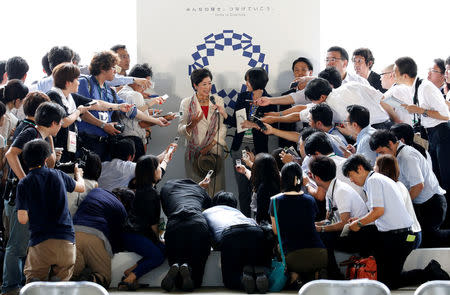 Tokyo governor Yuriko Koike talks to reporters after a ceremony to mark the arrival of the Olympic flag at Haneda airport in Tokyo, Japan, August 24, 2016. REUTERS/Kim Kyung-Hoon