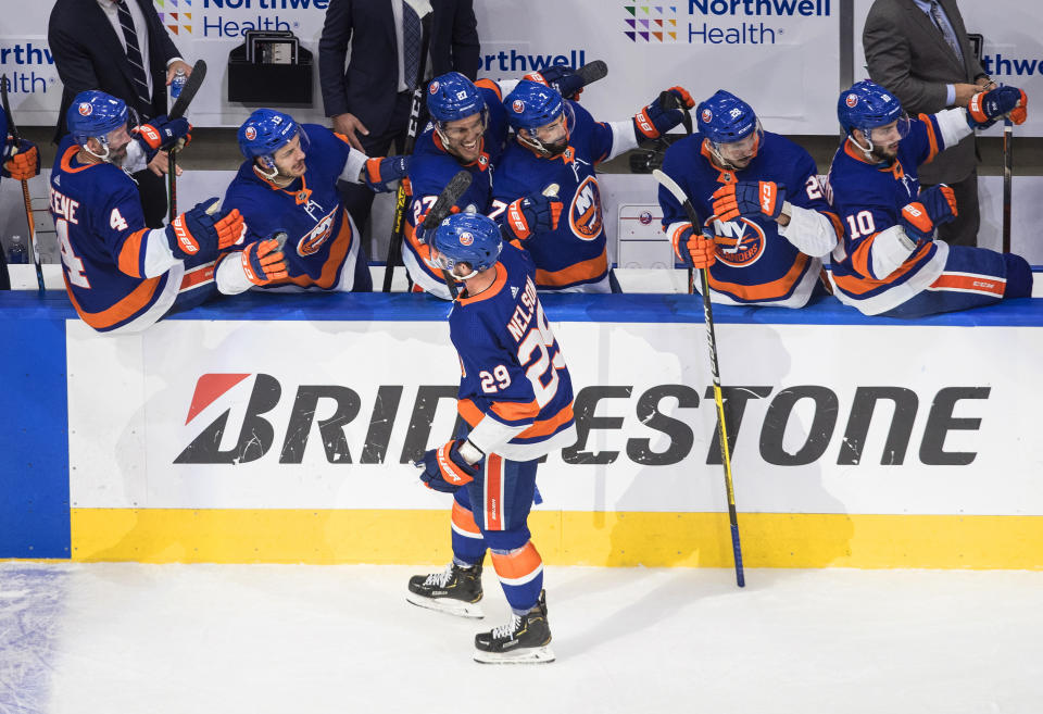 New York Islanders' Brock Nelson (29) is congratulated for his goal against the Tampa Bay Lightning during the third period of Game 3 of the NHL hockey Eastern Conference final, Friday, Sept. 11, 2020, in Edmonton, Alberta. (Jason Franson/The Canadian Press via AP)