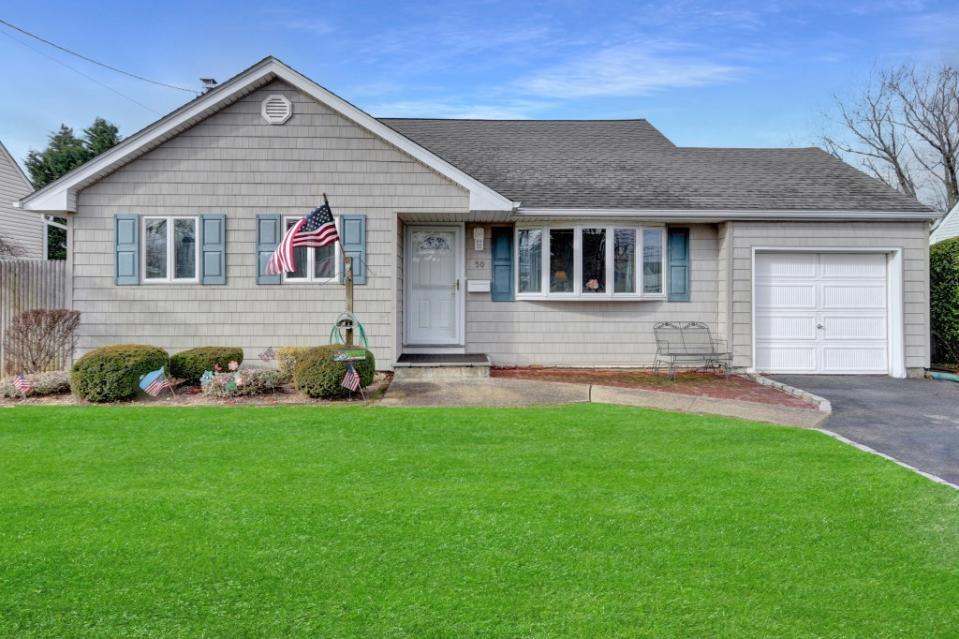 The exterior of the home, which will soon have new owners. Scott Schwartz / Long Island Virtual Photography