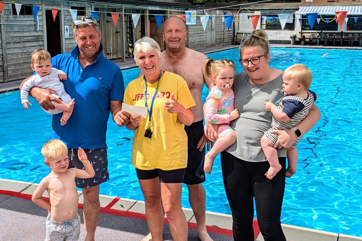 (L-R) Riley & Kit Kennett, Martin Greenway presenting the cheque to Liz Hurry (Chair of WiveyPool) Chris Briggs, and Darcie, Oscar & Charmaine Veryard <i>(Image: Supplied)</i>