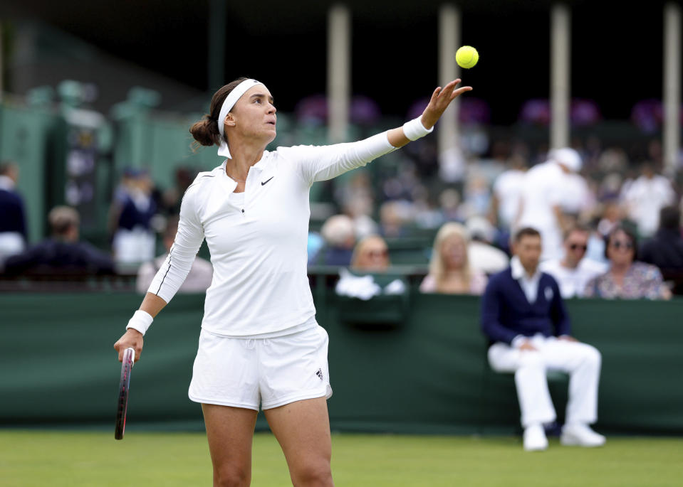 Ukraine's Anhelina Kalinina in action against Hungary's Anna Bondar during a women's singles first round match on day one of the Wimbledon tennis championships in London, Monday, June 27, 2022. (John Walton/PA via AP)