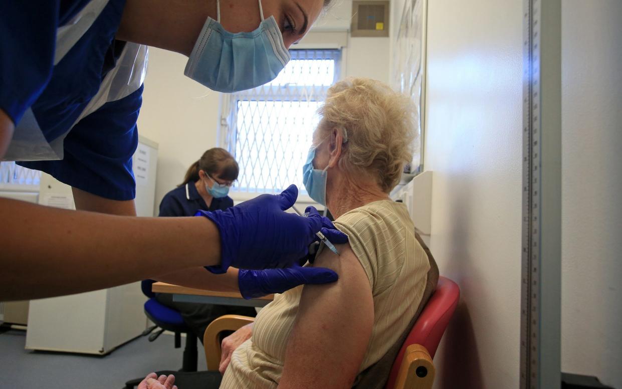 Woman being given vaccine - Lindsey Parnaby/AFP