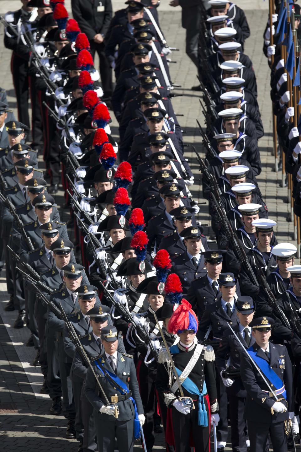 Different Italian armed forces officers parade ahead of Pope Francis' Easter Mass in St. Peter's Square at the the Vatican, Sunday, April 20, 2014. (AP Photo/Alessandra Tarantino)