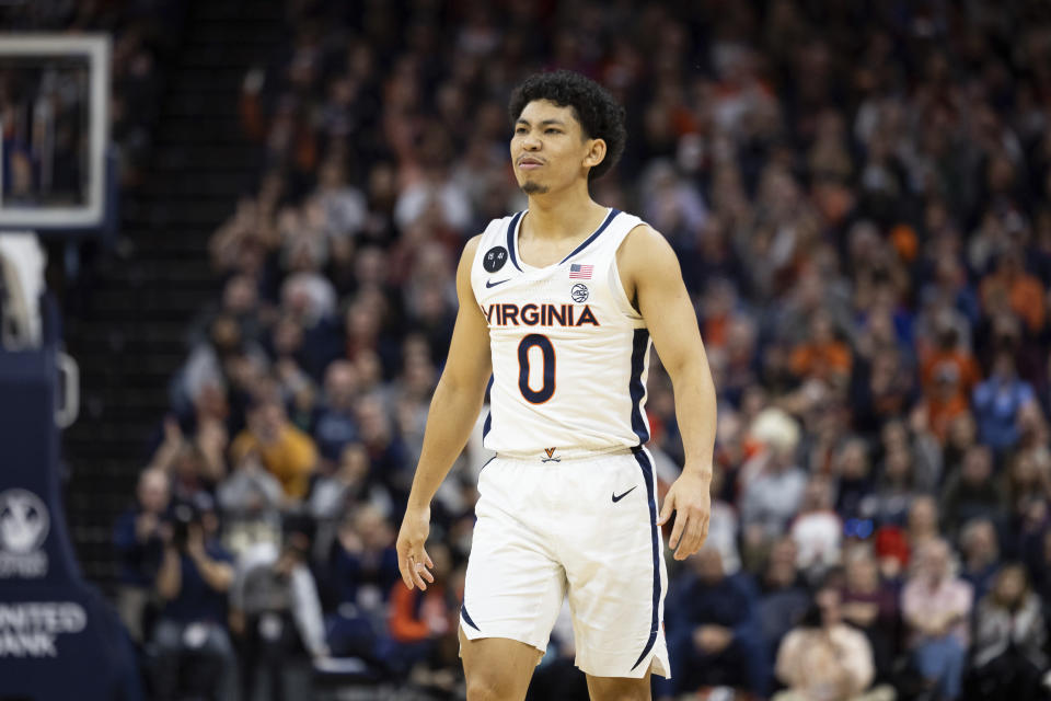 Virginia's Kihei Clark (0) celebrates after a basket against Albany during the second half of an NCAA college basketball game in Charlottesville, Va., Wednesday, Dec. 28, 2022. (AP Photo/Mike Kropf)