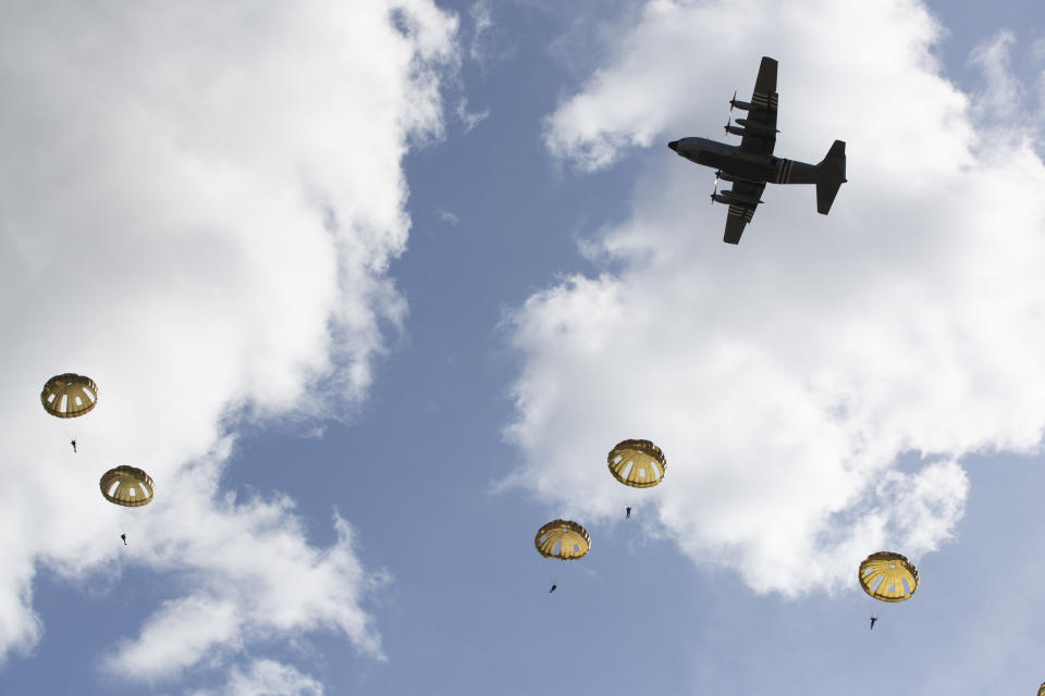 Parachutist jump from a plane near Groesbeek, Netherlands, Thursday, Sept. 19, 2019, as part of commemorations marking the 75th anniversary of Operation Market Garden, an ultimately unsuccessful airborne and land offensive that Allied leaders hoped would bring a swift end to World War II by capturing key Dutch bridges and opening a path to Berlin. (AP Photo/Peter Dejong)