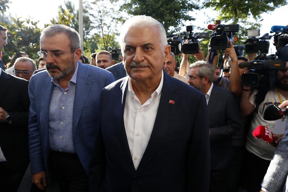 Binali Yildirim mayoral candidate for Istanbul arrives at Turkey's ruling Justice and Development Party, AKP, offices in Istanbul, Sunday, June 23, 2019. Polls have closed in Istanbul after voters cast ballots in a re-run mayoral election after a March 31 vote was voided for procedural irregularities. (AP Photo/Emrah Gurel)