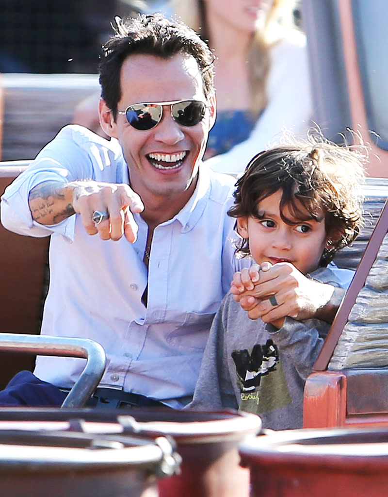 Marc Anthony with his girlfriend and his twins at Disneyland, CA