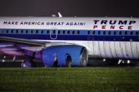 Men inspect a campaign plane that had been carrying U.S. Republican vice presidential candidate Mike Pence after it skidded off the runway while landing in the rain at LaGuardia Airport in New York, U.S.,October 27, 2016. REUTERS/Lucas Jackson