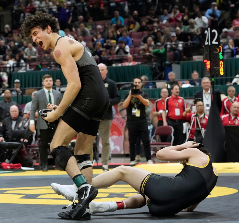 Omar Ayoub of Dublin Coffman celebrates his Division I state title at 138 pounds.