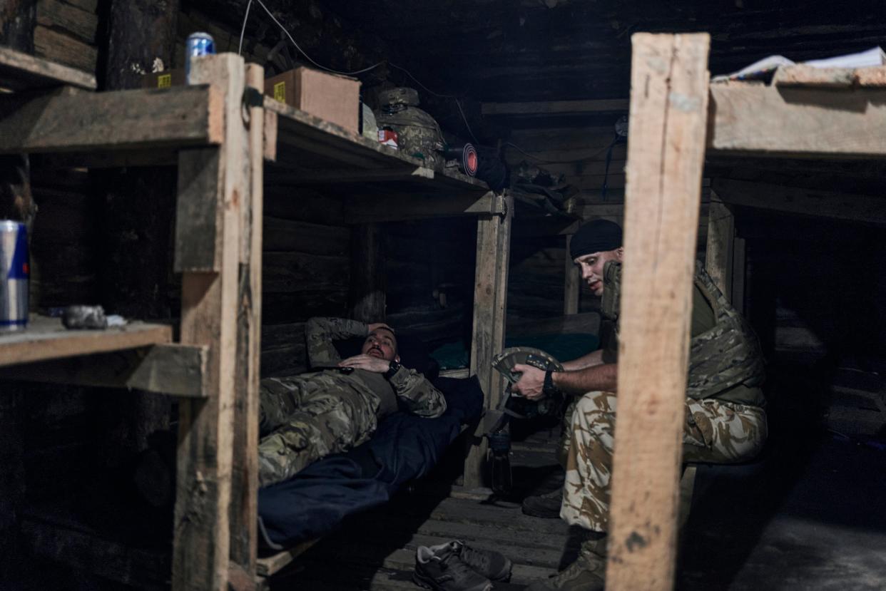 Ukrainian soldiers rest in a shelter at the front line near Bakhmut, Donetsk region (AP)