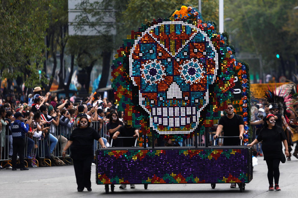 A float with a skull figure participates in a procession to commemorate Day of the Dead in Mexico City on Saturday.