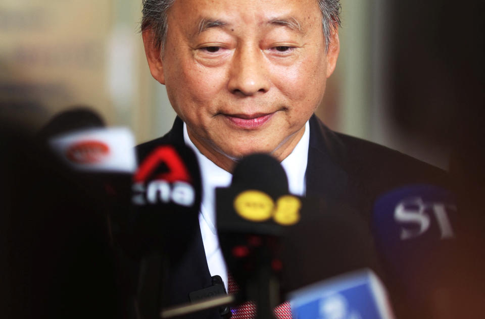 Potential presidential candidate George Goh takes questions from the media outside the Elections Department in Singapore on 13 June 2023.