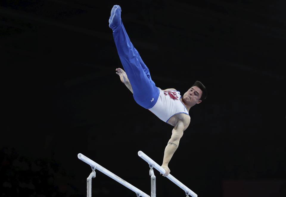 Nikita Nagornyy of Russia performs on the horizontal bar in the men's all-around final at the Gymnastics World Championships in Stuttgart, Germany, Friday, Oct. 11, 2019. (AP Photo/Matthias Schrader)