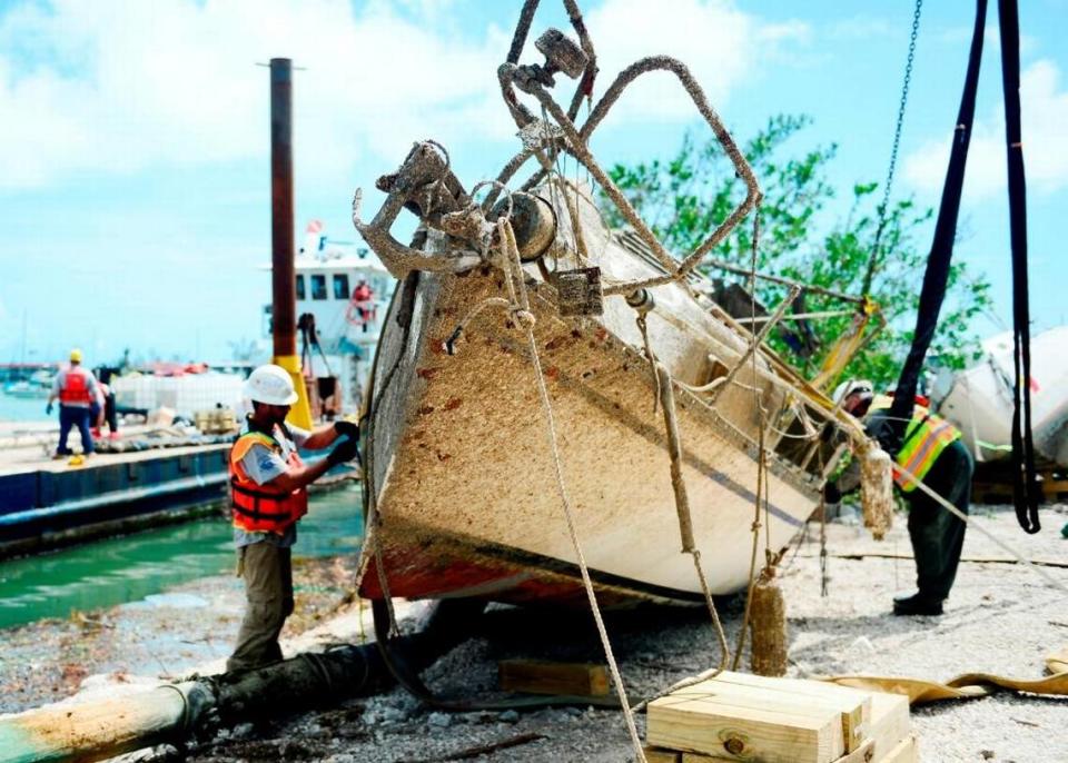 Contractors work Oct. 11, 2017, to remove a vessel displaced by Hurricane Irma at Boot Key Harbor City Marina in Marathon.