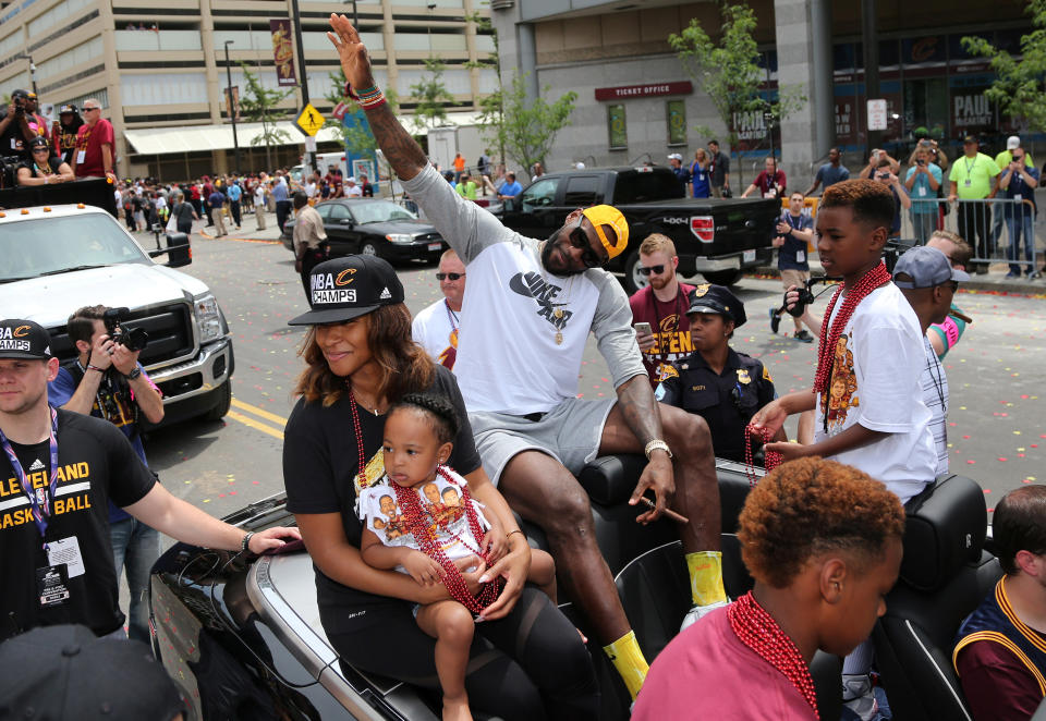 Cleveland Cavaliers Lebron James waves to the crowd during a parade to celebrate winning the 2016 NBA Championship in downtown Cleveland, Ohio, U.S. June 22, 2016. REUTERS/Aaron Josefczyk