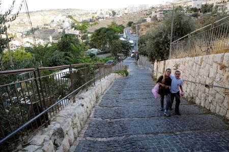 Israeli boys walk on a street in Silwan, a Palestinian neighbourhood close to Jerusalem's Old City June 29, 2016. REUTERS/Ammar Awad