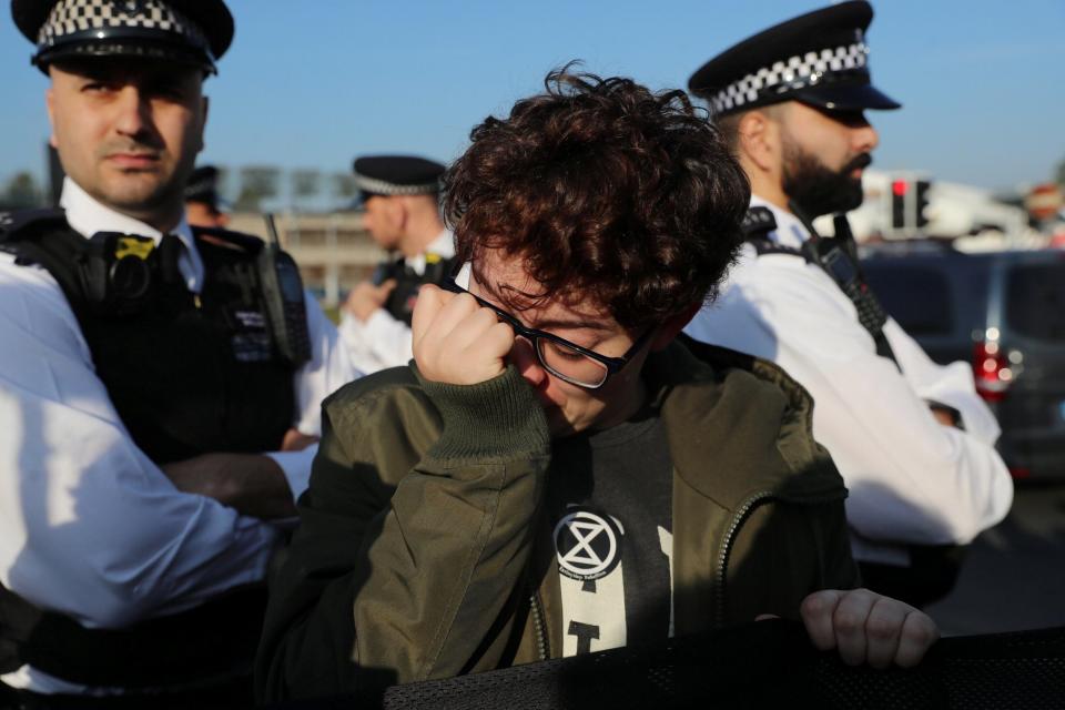 A protester reacts during the demonstration at Britain's busiest airport (REUTERS)