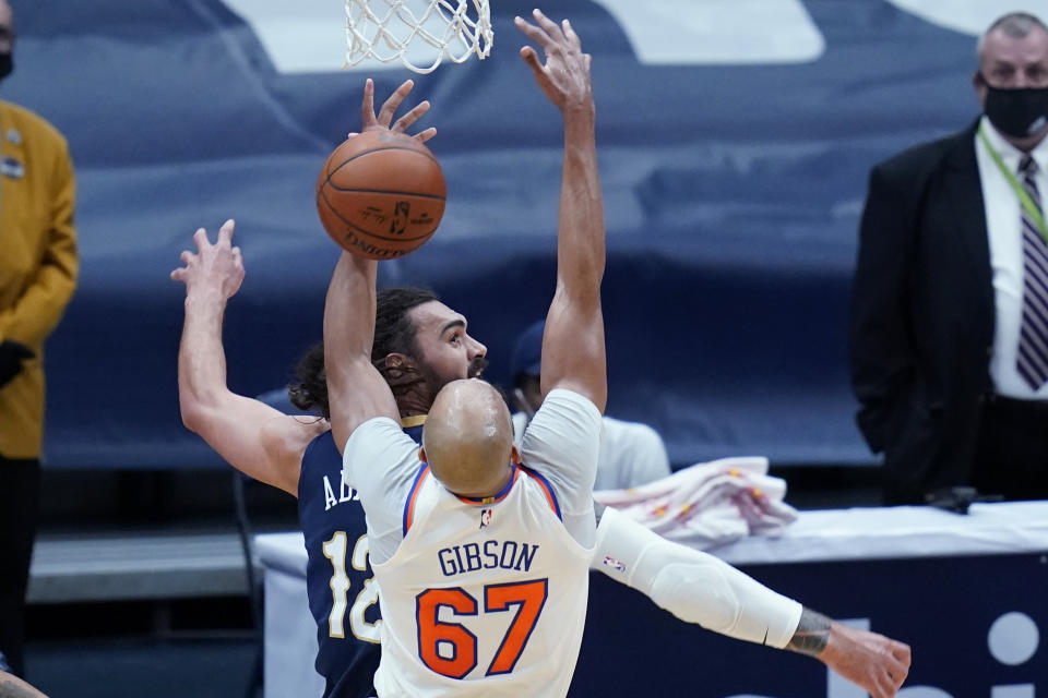 New York Knicks center Taj Gibson (67) and New Orleans Pelicans center Steven Adams (12) battle for a rebound in the first half of an NBA basketball game in New Orleans, Wednesday, April 14, 2021. (AP Photo/Gerald Herbert)