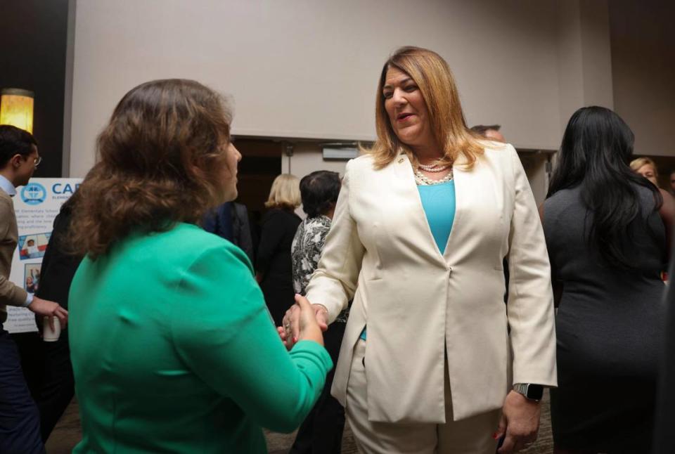 Madeline Pumariega, president of Miami Dade College, talks to another attendee during a Trustee Luncheon hosted by the Greater Miami Chamber of Commerce on Wednesday, April 5, 2023, at the Jungle Island Bloom Ballroom.