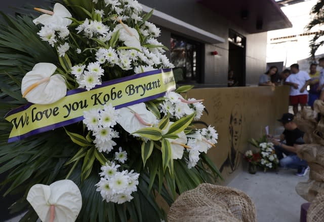 Flowers were left at the “House of Kobe” basketball court in Valenzuela