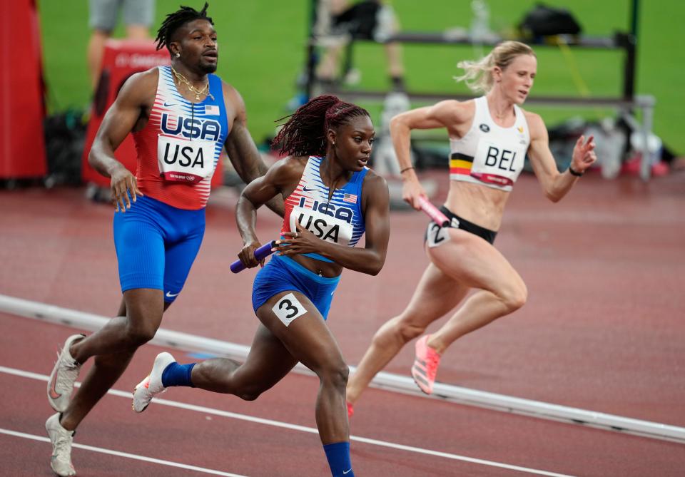 Lynna Irby (USA) competes in the 4x400 relay mixed qualification round 1 heat 1during the Tokyo 2020 Olympic Summer Games at Olympic Stadium.