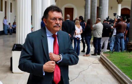 Venezuela's deputy of Venezuela's United Socialist Party (PSUV) German Ferrer leaves Venezuela's National Assembly after a session in Caracas, Venezuela July 3, 2017. REUTERS/Marco Bello