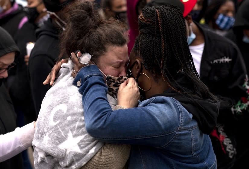 BROOKLYN CENTER, MN - APRIL 12: Katie Wright (L), the mother of Daunte Wright, is embraced during a vigil for her son on April 12, 2021 in Brooklyn Center, Minnesota. Wright was shot and killed yesterday by Brooklyn Center police during a traffic stop. (Photo by Stephen Maturen/Getty Images)
