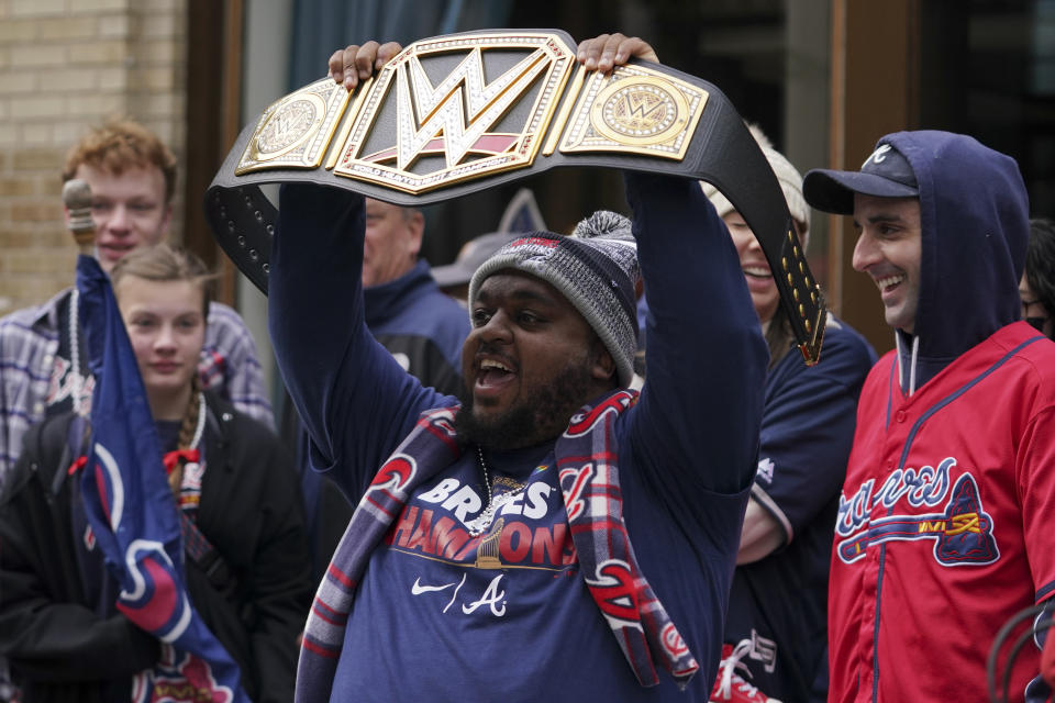 Basaeball fans cheer ahead of a victory parade, Friday, Nov. 5, 2021, in Atlanta. The Braves beat the Houston Astros 7-0 in Game 6 on Tuesday to win their first World Series baseball title in 26 years. (AP Photo/Brynn Anderson)