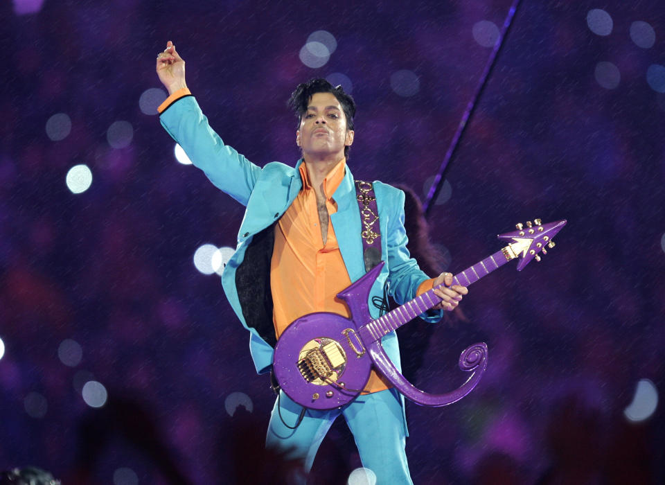 FILE - In this Feb. 4, 2007, file photo, Prince performs during the halftime show at the Super Bowl XLI NFL football game at Dolphin Stadium in Miami. A year after Prince died of an accidental drug overdose, his Paisley Park studio complex and home is now a museum and concert venue. Prince left no known will and had no known children when he died April 21, 2016, and the judge overseeing Prince's estate has yet to formally declare six of his siblings as its heirs. (AP Photo/Chris O'Meara, File)