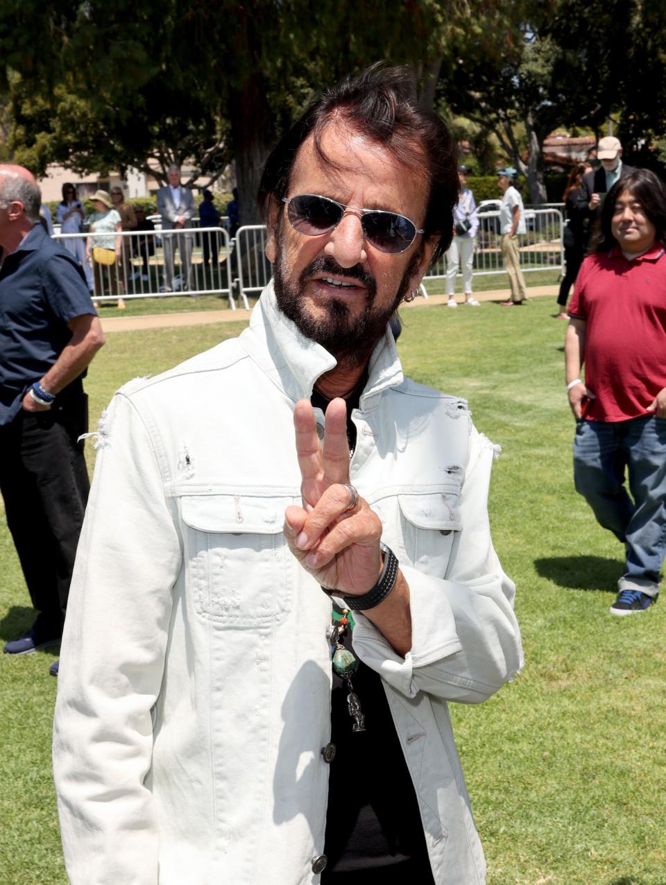 BEVERLY HILLS, CALIFORNIA - JULY 07: Ringo Starr visits his 'Peace and Love' sculpture to celebrate his 81st birthday on July 07, 2021 in Beverly Hills, California. (Photo by Kevin Winter/Getty Images)