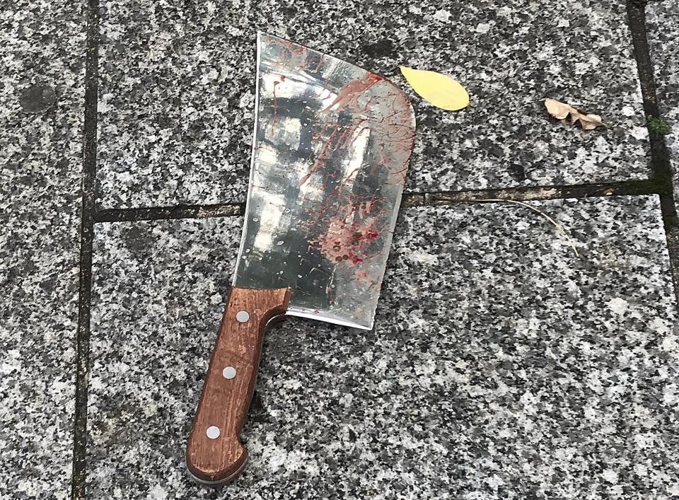 A meat cleaver that was use in a knife attack is left on the ground in Paris, Friday, Sept. 25, 2020. French terrorism authorities are investigating the knife attack that wounded at least two people Friday near the former offices of the satirical newspaper Charlie Hebdo in Paris, authorities said. A suspect has been arrested. (David Cohen via AP)