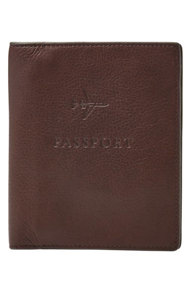 <p>(Cost: $55) Every international traveler needs money, tickets, and a passport before boarding a plane. Keep all three in the same place with this <a rel="nofollow noopener" href="https://www.fossil.com/us/en/products/leather-rfid-passport-case-sku-MLG0358001C.html?cid=pds:conv:google:shopping:Fossil-Men-Accessories-Passport:male:MLG0358001&mr:trackingCode=$(ReferralID)$&mr:referralID=NA&s_kwcid=AL!4524!3!75580175579!!!g!59620263137!&ef_id=WD3WyAAABfRtuB-q:20161205193721:s" target="_blank" data-ylk="slk:leather passport case;elm:context_link;itc:0;sec:content-canvas" class="link ">leather passport case</a> from Fossil. The small wallet comes with an interior passport slot, zip pocket, slip pocket and four card slots. It also comes in three different colors (black, brown and cognac) so you can stay color coordinated and organized. </p>