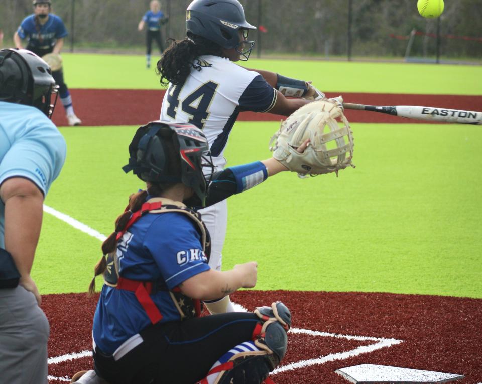 Paxon batter Jaela Palmer (44) fouls a pitch off against Clay during Monday's Walk-Off Charities Classic for high school softball.