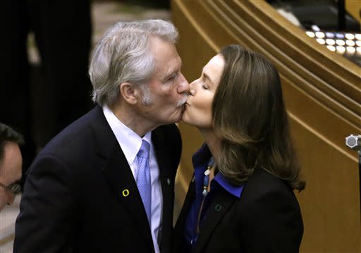 In this Jan. 12, 2015 file photo, Oregon Gov. John Kitzhaber kisses fiancee, Cylvia Hayes, after he is sworn in for an unprecedented fourth term as Governor in Salem, Ore. (AP Photo/Don Ryan)