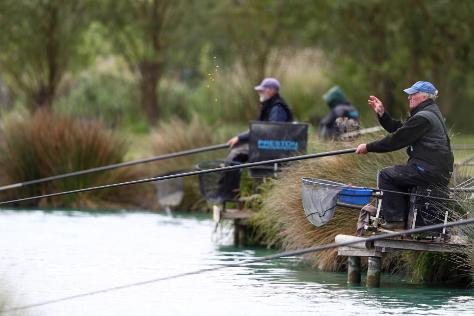 An angler throws bait at Acorn Fisheries in Kingston Seymour, Somerset.