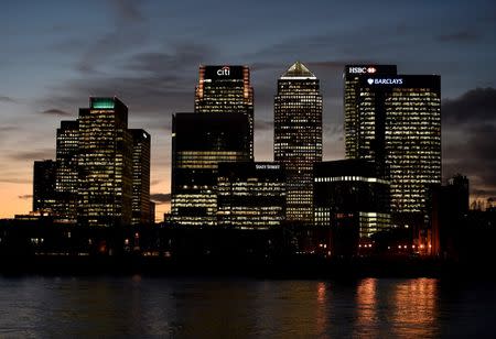 The Canary Wharf financial district is seen at dusk in east London, Britain November 7, 2014. REUTERS/Toby Melville/File Photo