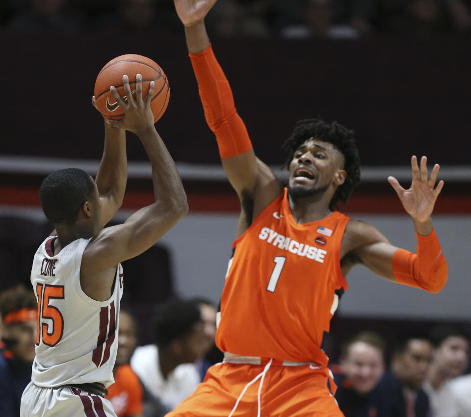 Virginia Tech; Jalen Cone (15) looks to pass around Syracuse's Quincy Guerrier (1) during the first half of an NCAA college basketball game in Blacksburg Va., Saturday, Jan. 18 2020. (Matt Gentry/The Roanoke Times via AP)