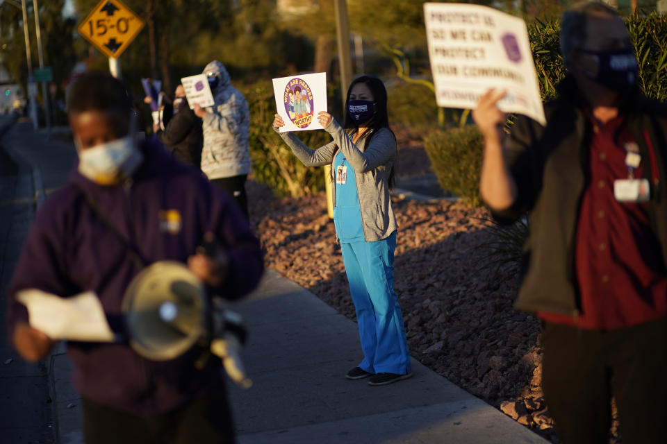 Healthcare workers protest coronavirus pandemic working conditions at Sunrise hospital Wednesday, Dec. 2, 2020, in Las Vegas. (AP Photo/John Locher)