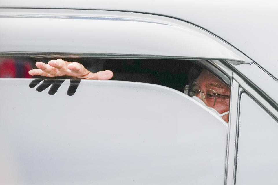 FILE - Former Malaysian Prime Minister Najib Razak waves to supporters as he leaves after a hearing in Kuala Lumpur on Aug. 25, 2022. Malaysia's Pardons Board said Friday, Feb. 2, 2024, it has reduced ex-Prime Minister Najib Razak's 12-year jail sentence by half and sharply cut the fine imposed after his corruption conviction. (AP Photo/Vincent Thian, File)