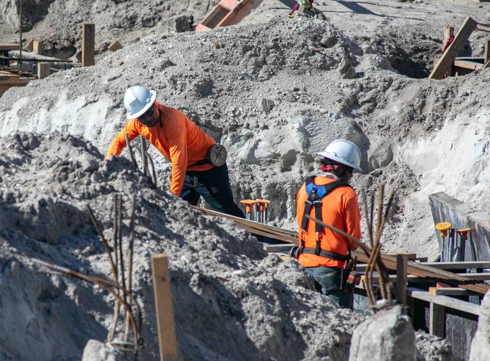 Construction crews, seen on April 5, are working to complete the Royal Poinciana Playhouse's shell structure, including masonry walls, concrete beams, columns, and the rest of the structural steel.