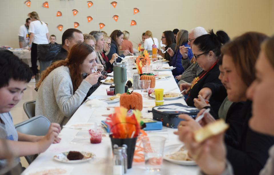 Students and staff at Ben Reifel Middle School enjoy a Thanksgiving meal together prepared by students in the RISE special education program on Nov. 18, 2022.