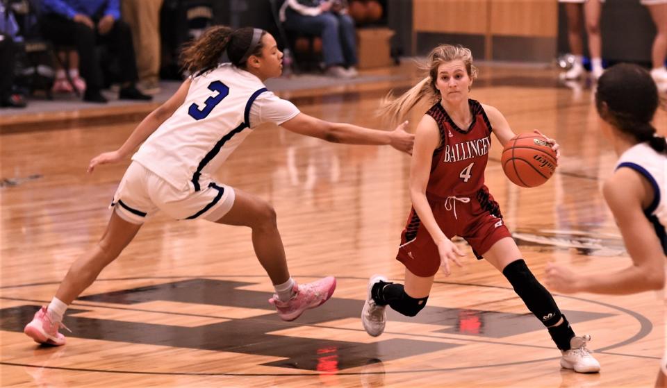 Ballinger's Addison Martin (4) tries to get around Wichita Falls City View's Emarei Brandon in the second half.