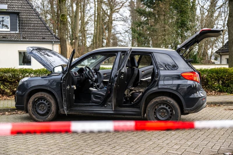 A car is parked behind a cordon near a barracks. A German Bundeswehr soldier is suspected of shooting dead four people in the Lower Saxony district of Rotenburg, before turning himself in, the police and prosecution announced on Friday. Sina Schuldt/dpa