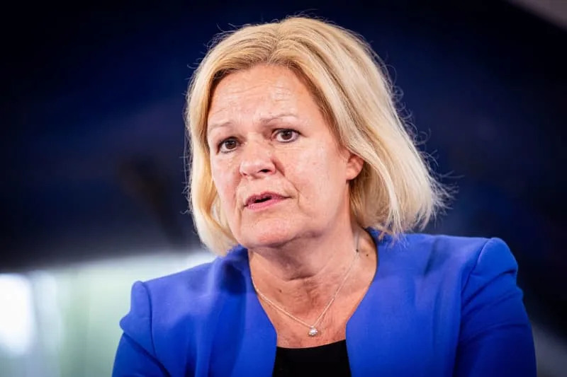 German Minister of the Interior Nancy Faeser makes a press statement during her visit to the Gifhorn base of the Federal Police Air Wing. Moritz Frankenberg/dpa