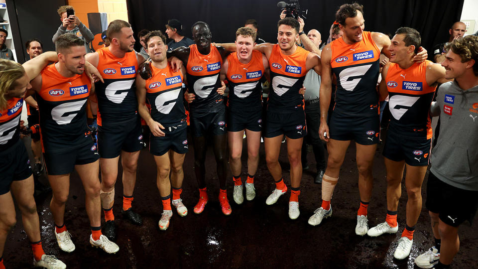 The GWS Giants are pictured celebrating their win over Essendon.